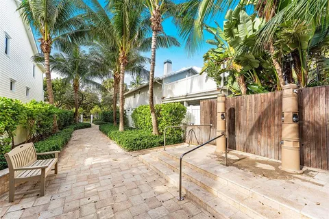 an aerial view of a house with a yard and garden