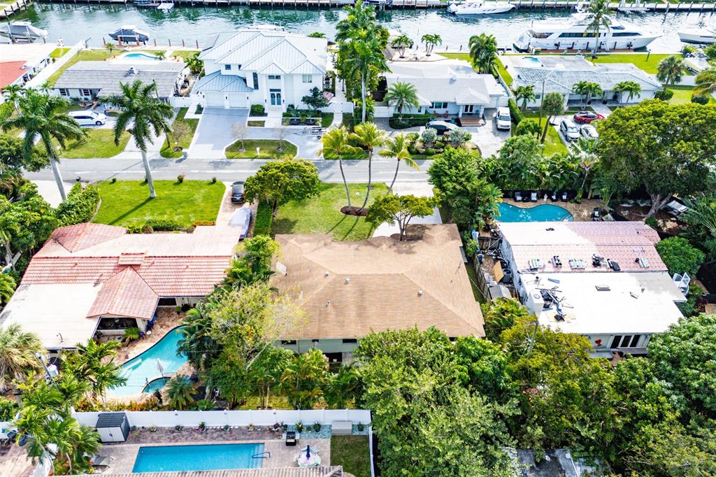 3203 Dover Road Pompano Beach, FL 33062 - Photo 44 of 54 an aerial view of multiple houses with yard