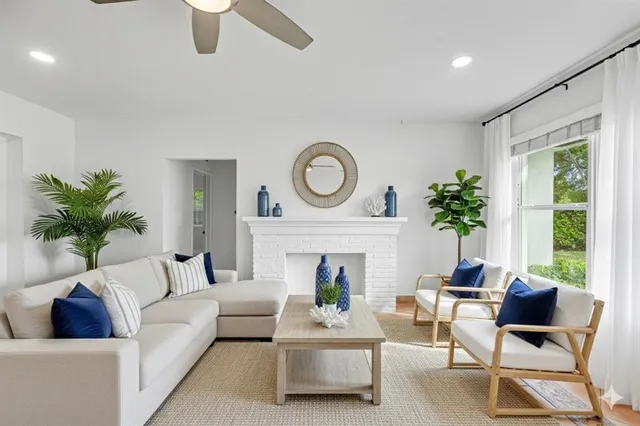 a kitchen with stainless steel appliances kitchen island granite countertop a refrigerator and a stove top oven