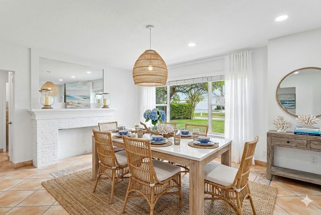 3203 Dover Road Pompano Beach, FL 33062 - Photo 8 of 54 a dining room with furniture a chandelier and wooden floor