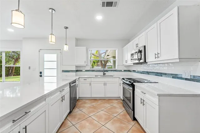 a dining room with furniture and a garden