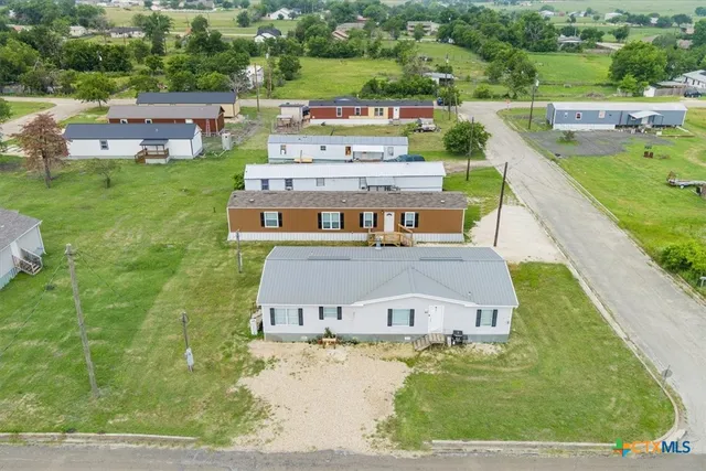 an aerial view of a house with a garden