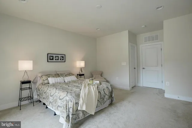 a bedroom with bed and a window