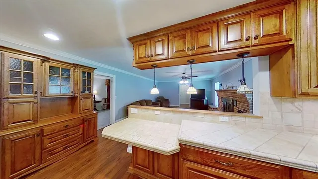 a kitchen with stainless steel appliances granite countertop a sink and cabinets