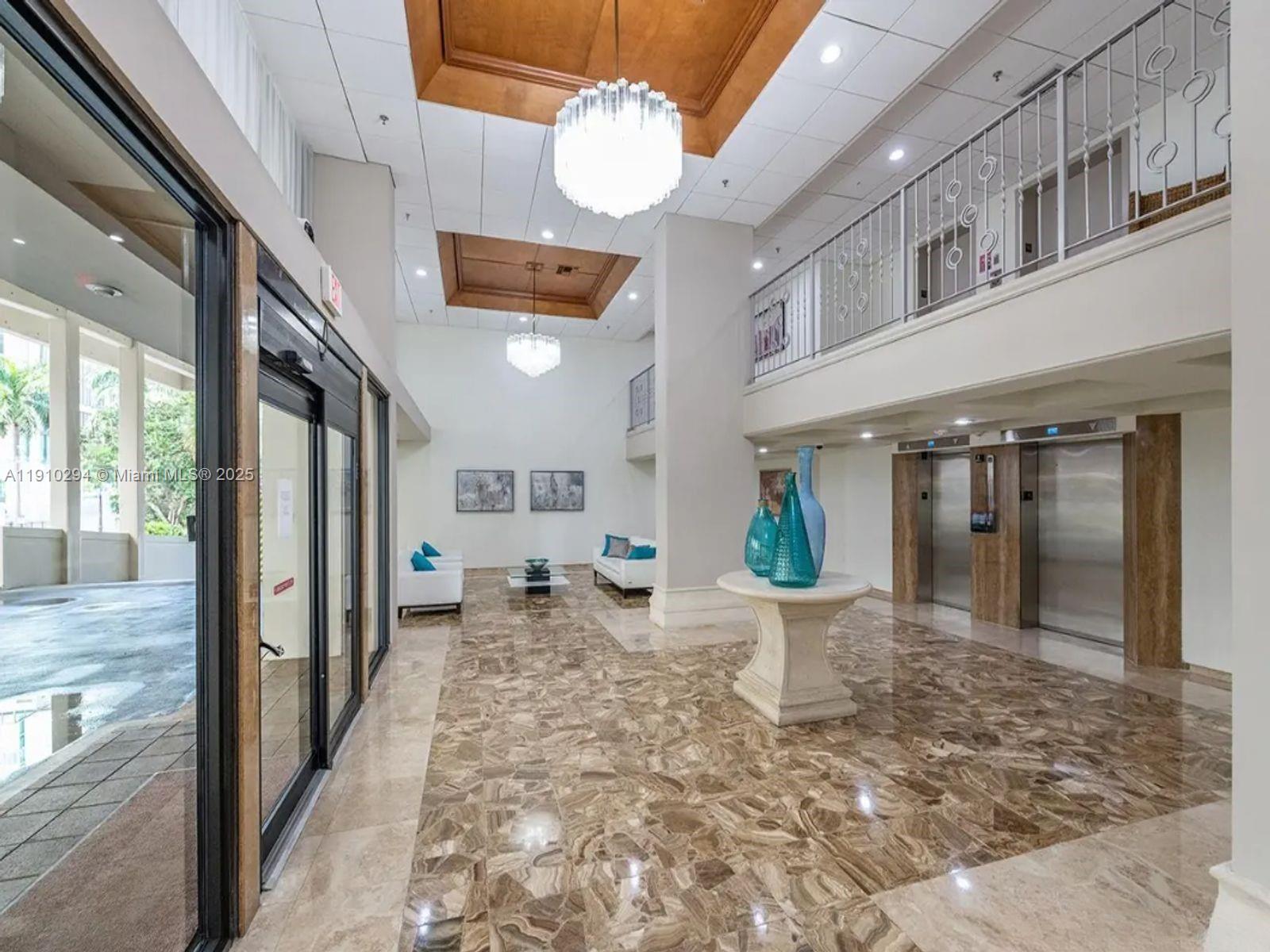 6061 Collins Avenue, Unit 11A Miami Beach, FL 33140 - Photo 4 of 30 a very nice looking room with a dining table and chairs