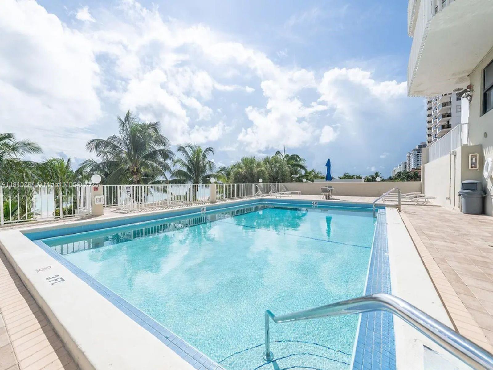 6061 Collins Avenue, Unit 11A Miami Beach, FL 33140 - Photo 5 of 30 a view of swimming pool with a yard