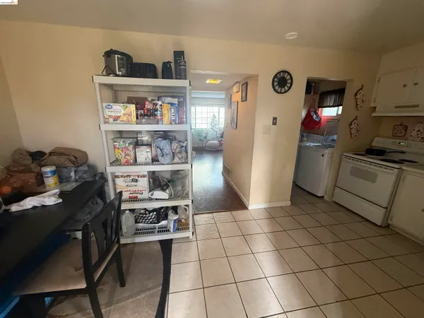 a kitchen with stainless steel appliances a refrigerator and a stove top oven