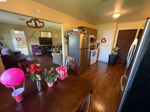 a kitchen with a refrigerator and a stove