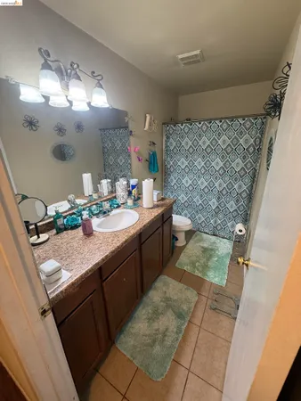 a bathroom with a sink a mirror and a shower