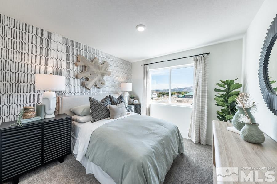 1605 Switchback Street, Unit LOT #29 Reno, NV 89523 - Photo 16 of 20 a bedroom with a bed and a potted plant