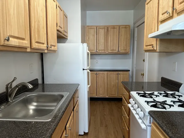 a kitchen that has a sink and a stove