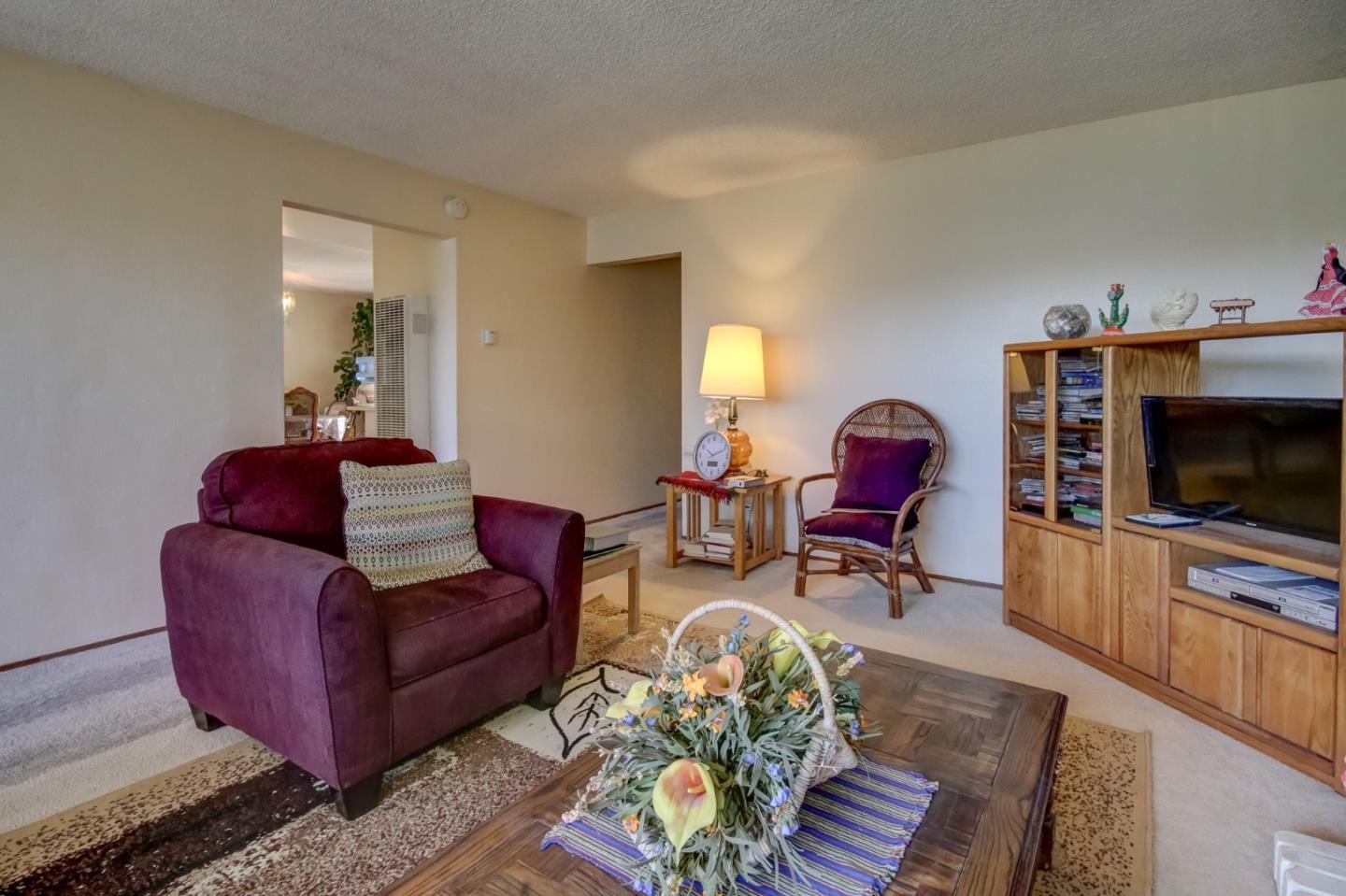 1759 Emerald Drive Salinas, CA 93906 - Photo 6 of 21 a living room with furniture and a flat screen tv