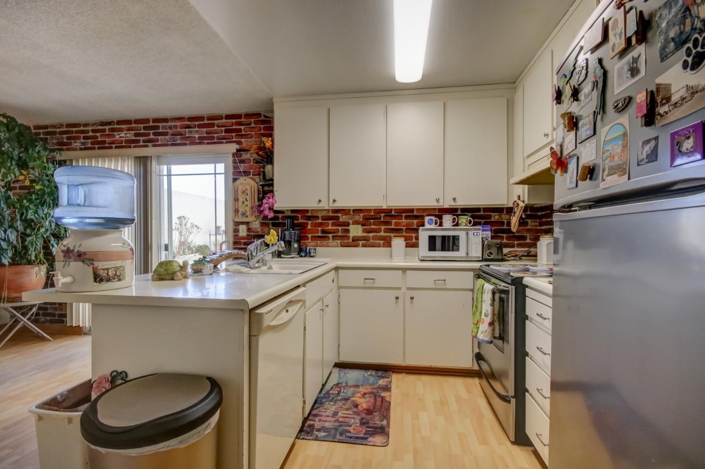 1759 Emerald Drive Salinas, CA 93906 - Photo 9 of 21 a kitchen with a sink stove and cabinets