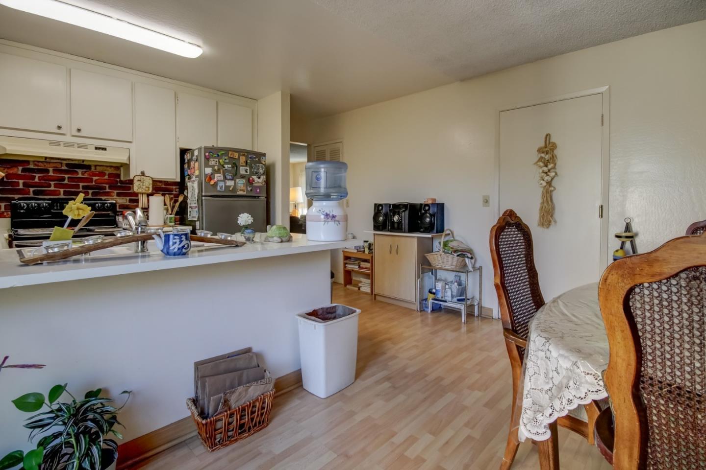 1759 Emerald Drive Salinas, CA 93906 - Photo 10 of 21 a living room with furniture a flat screen tv and kitchen view