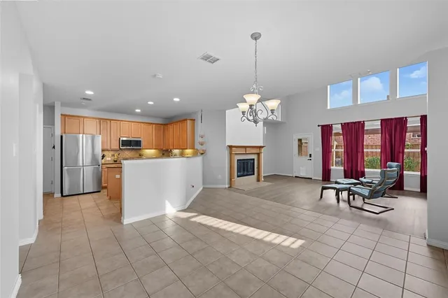a view of a kitchen with dining table and chairs