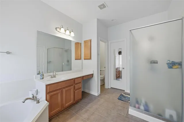 a bathroom with a sink vanity and a mirror
