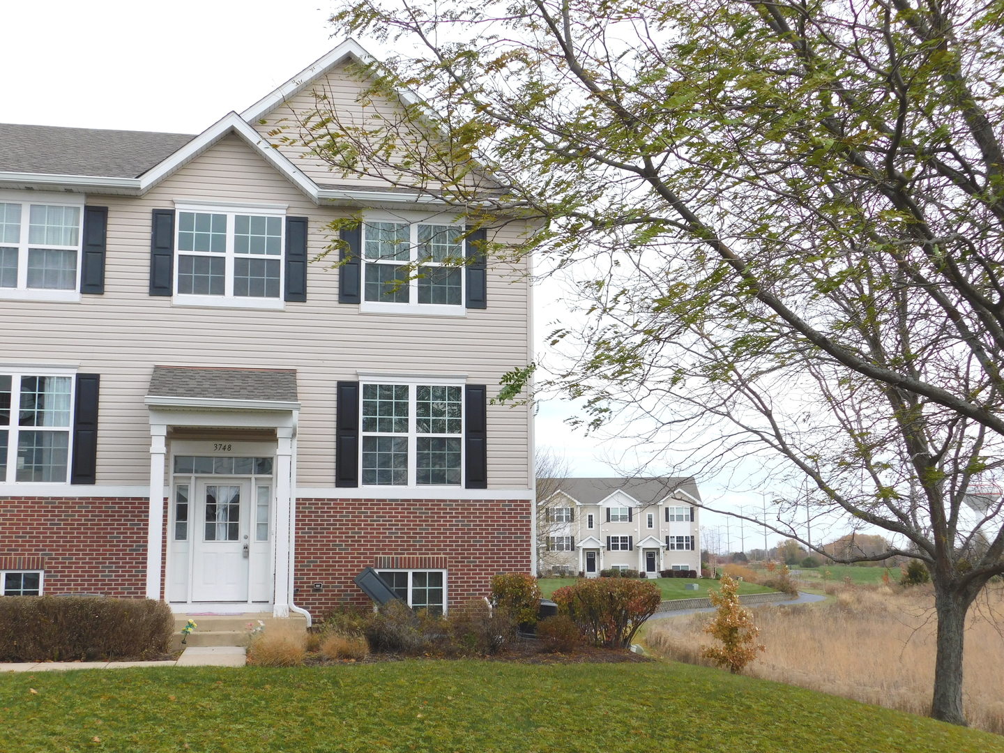 a view of a house with a yard