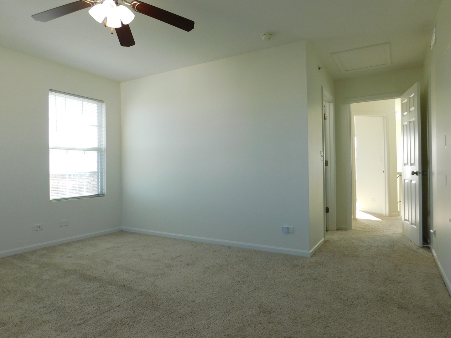 3748 Bailey Road, Unit 3748 Yorkville, IL 60560 - Photo 17 of 27 an empty room with a window and a chandelier fan