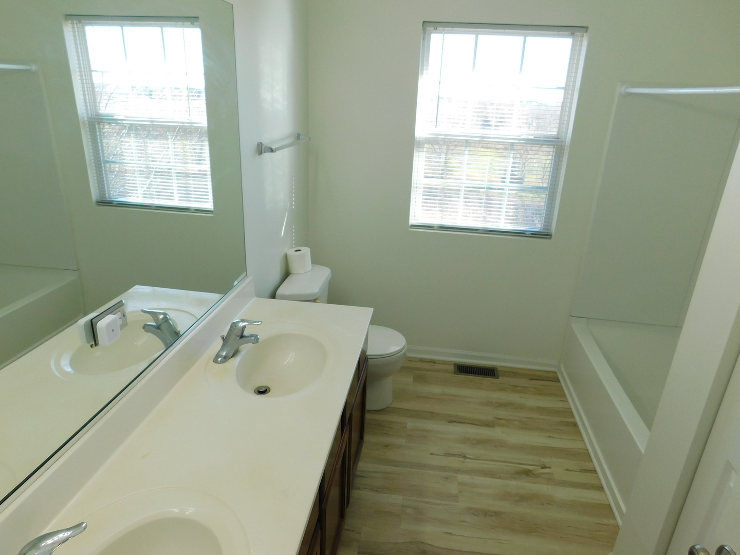 3748 Bailey Road, Unit 3748 Yorkville, IL 60560 - Photo 19 of 27 a bathroom with a tub sink and window