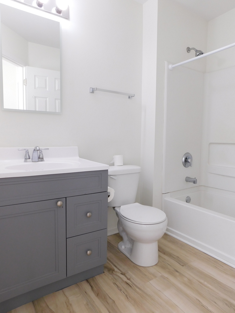 3748 Bailey Road, Unit 3748 Yorkville, IL 60560 - Photo 22 of 27 a bathroom with a sink toilet a mirror and shower