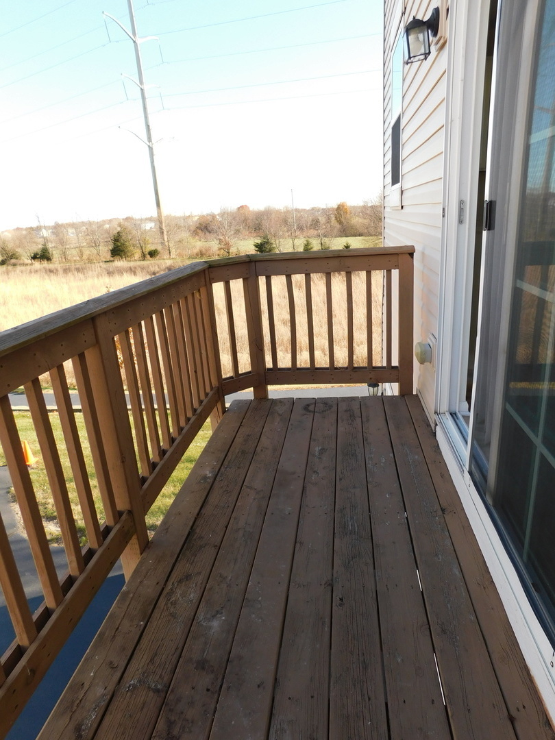 3748 Bailey Road, Unit 3748 Yorkville, IL 60560 - Photo 25 of 27 a view of a balcony with wooden floor