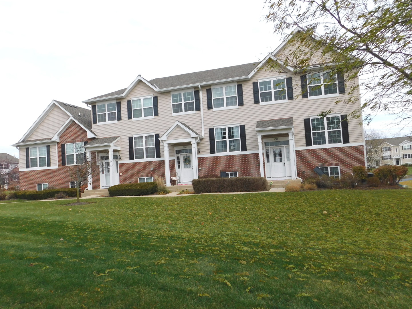 3748 Bailey Road, Unit 3748 Yorkville, IL 60560 - Photo 3 of 27 a front view of a house with a garden