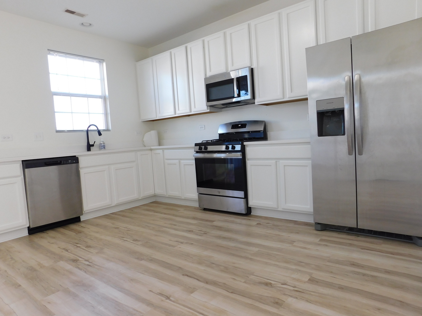 3748 Bailey Road, Unit 3748 Yorkville, IL 60560 - Photo 6 of 27 a kitchen with stainless steel appliances a refrigerator sink and microwave
