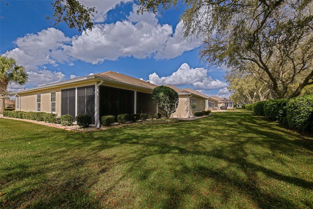 8850 Southeast 140th Place Road Summerfield, FL 34491 - Photo 17 of 98 a front view of house with yard and green space