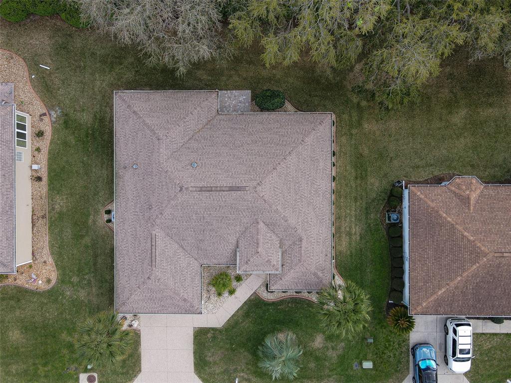 8850 Southeast 140th Place Road Summerfield, FL 34491 - Photo 2 of 98 an aerial view of a house with a yard