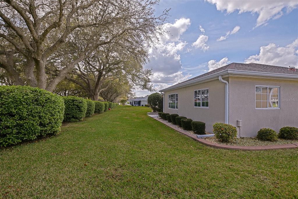 8850 Southeast 140th Place Road Summerfield, FL 34491 - Photo 21 of 98 a view of a house with a backyard