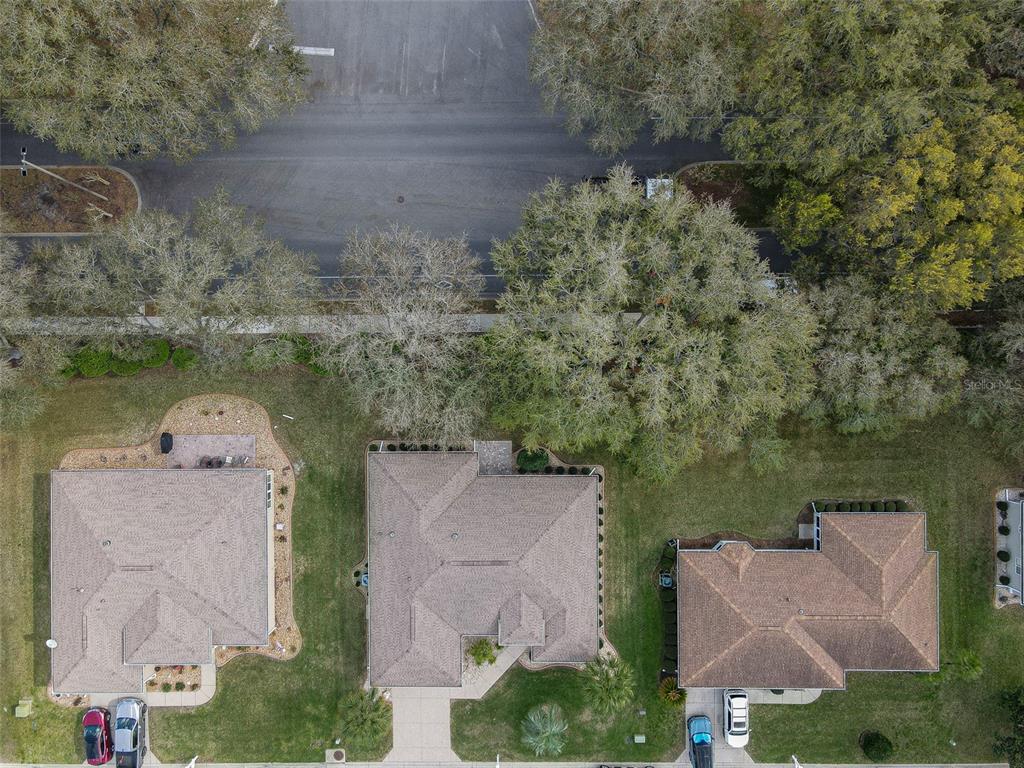 8850 Southeast 140th Place Road Summerfield, FL 34491 - Photo 3 of 98 an aerial view of a house with outdoor space and lake view
