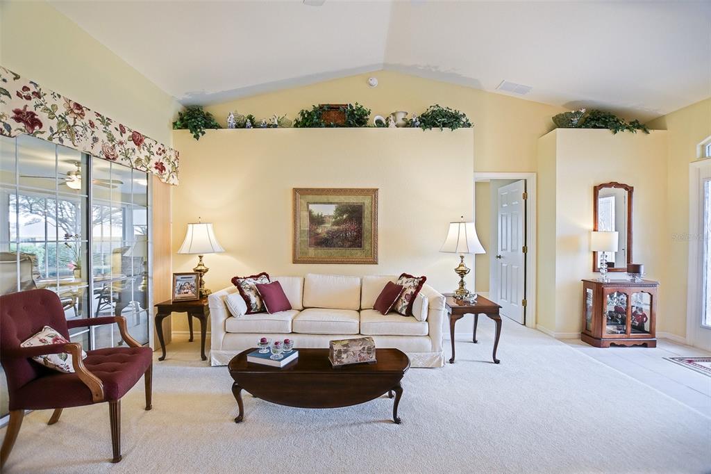 8850 Southeast 140th Place Road Summerfield, FL 34491 - Photo 33 of 98 a living room with furniture and a large window