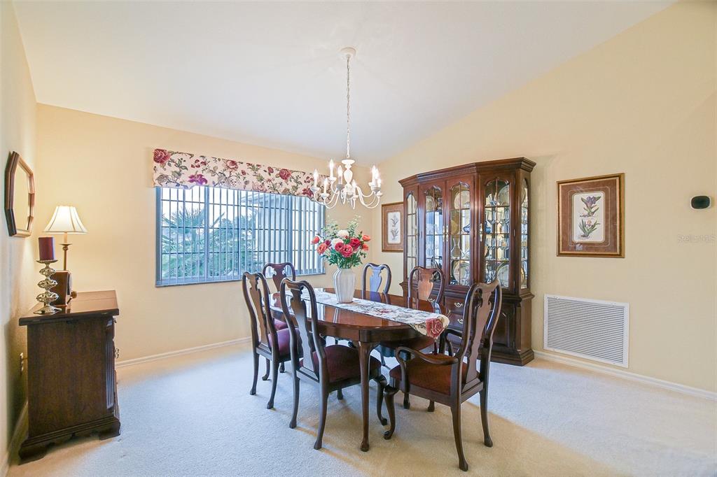 8850 Southeast 140th Place Road Summerfield, FL 34491 - Photo 34 of 98 a view of a dining room with furniture window and outside view