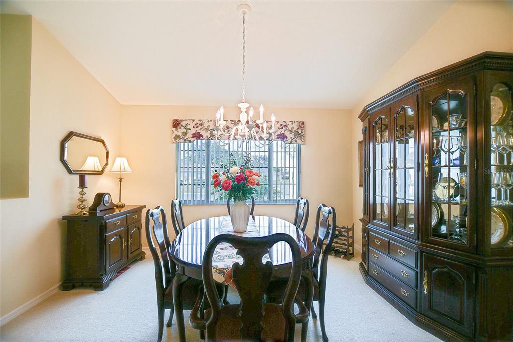 8850 Southeast 140th Place Road Summerfield, FL 34491 - Photo 36 of 98 a view of a dining room with furniture window and outside view