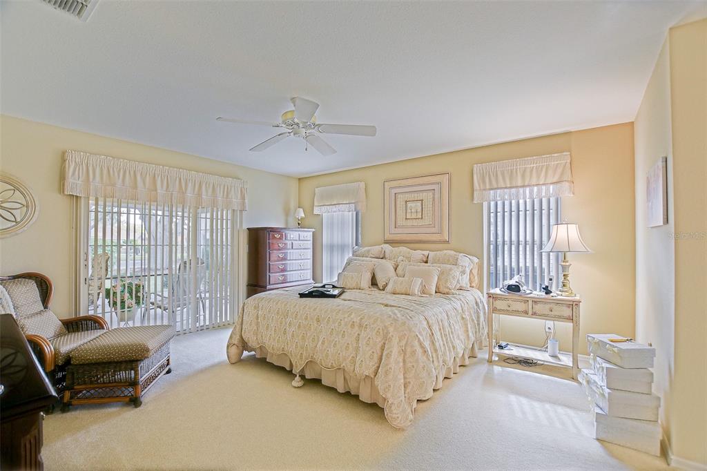 8850 Southeast 140th Place Road Summerfield, FL 34491 - Photo 37 of 98 a bedroom with a bed and a couch
