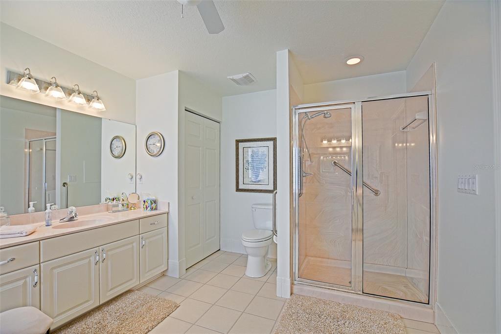 8850 Southeast 140th Place Road Summerfield, FL 34491 - Photo 43 of 98 a spacious bathroom with a double vanity sink mirror and shower