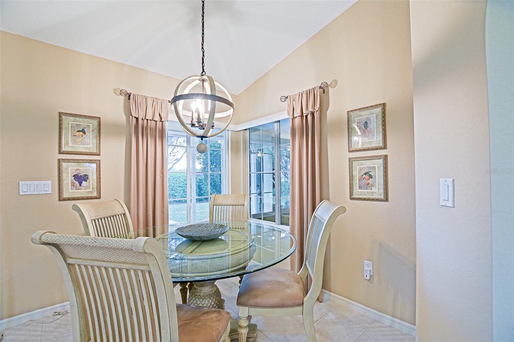 8850 Southeast 140th Place Road Summerfield, FL 34491 - Photo 45 of 98 a view of a dining room with furniture and a chandelier