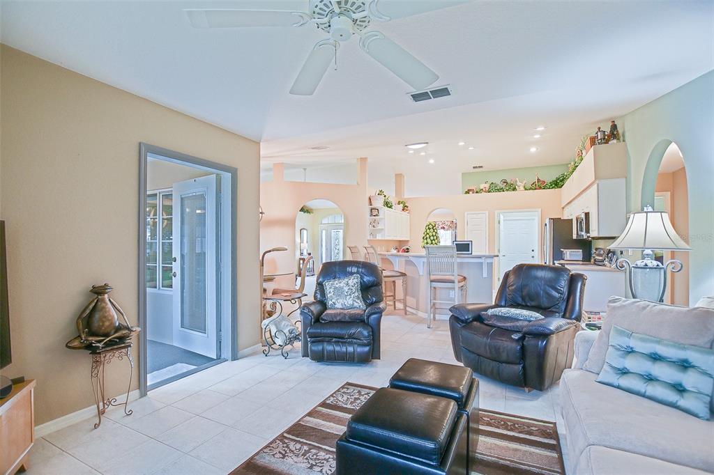 8850 Southeast 140th Place Road Summerfield, FL 34491 - Photo 53 of 98 a living room with furniture ceiling fan and a rug