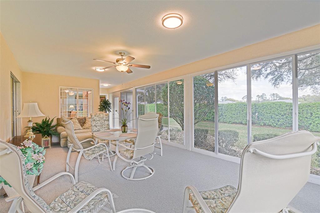 8850 Southeast 140th Place Road Summerfield, FL 34491 - Photo 57 of 98 a living room with furniture and a large window