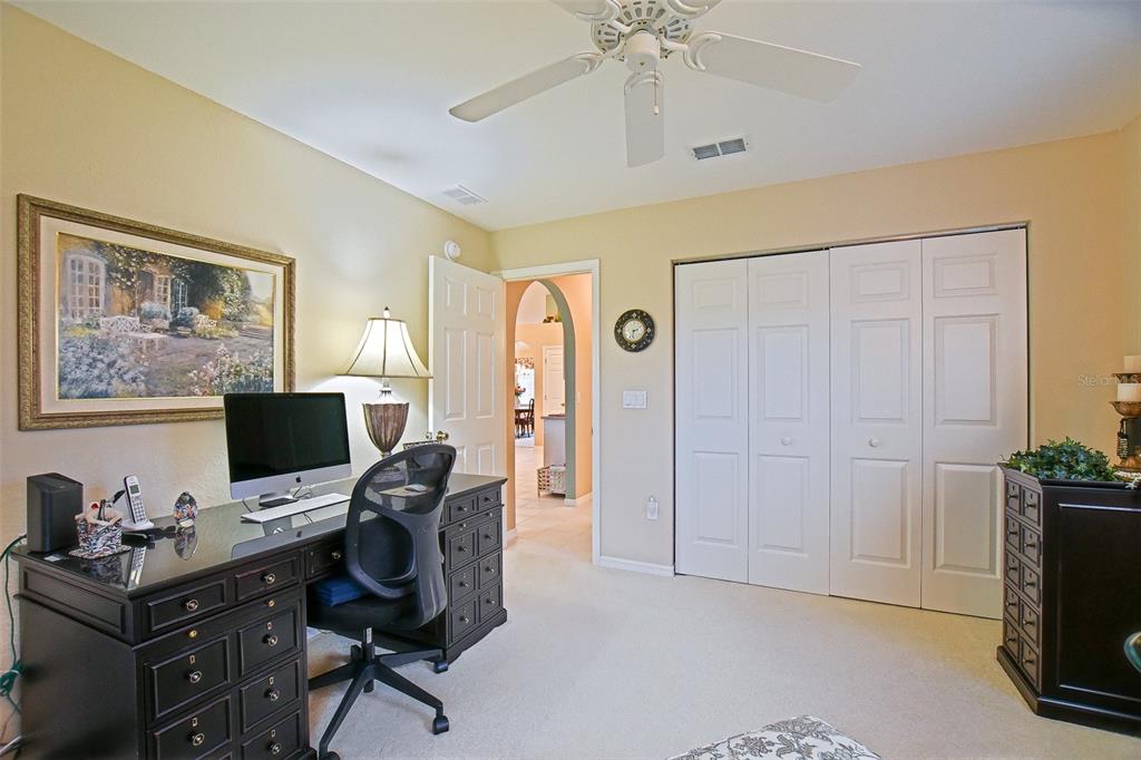 8850 Southeast 140th Place Road Summerfield, FL 34491 - Photo 60 of 98 a view of a workspace with furniture and a window
