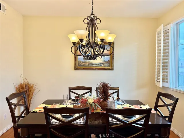 a view of a dining room with furniture and window