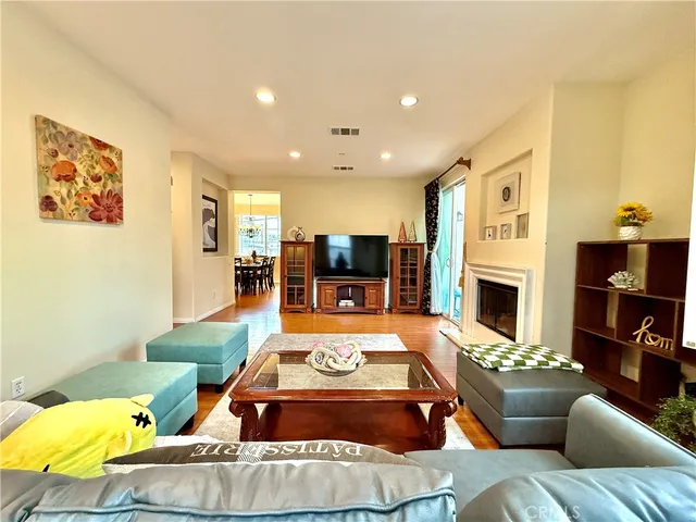 a living room with furniture fireplace and a flat screen tv