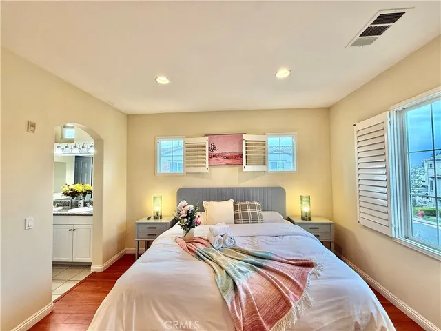 a bedroom with a bed and a table