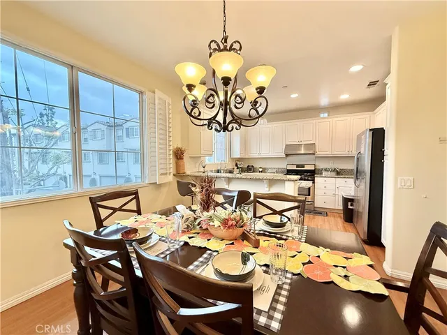 a view of a dining room and hall with furniture