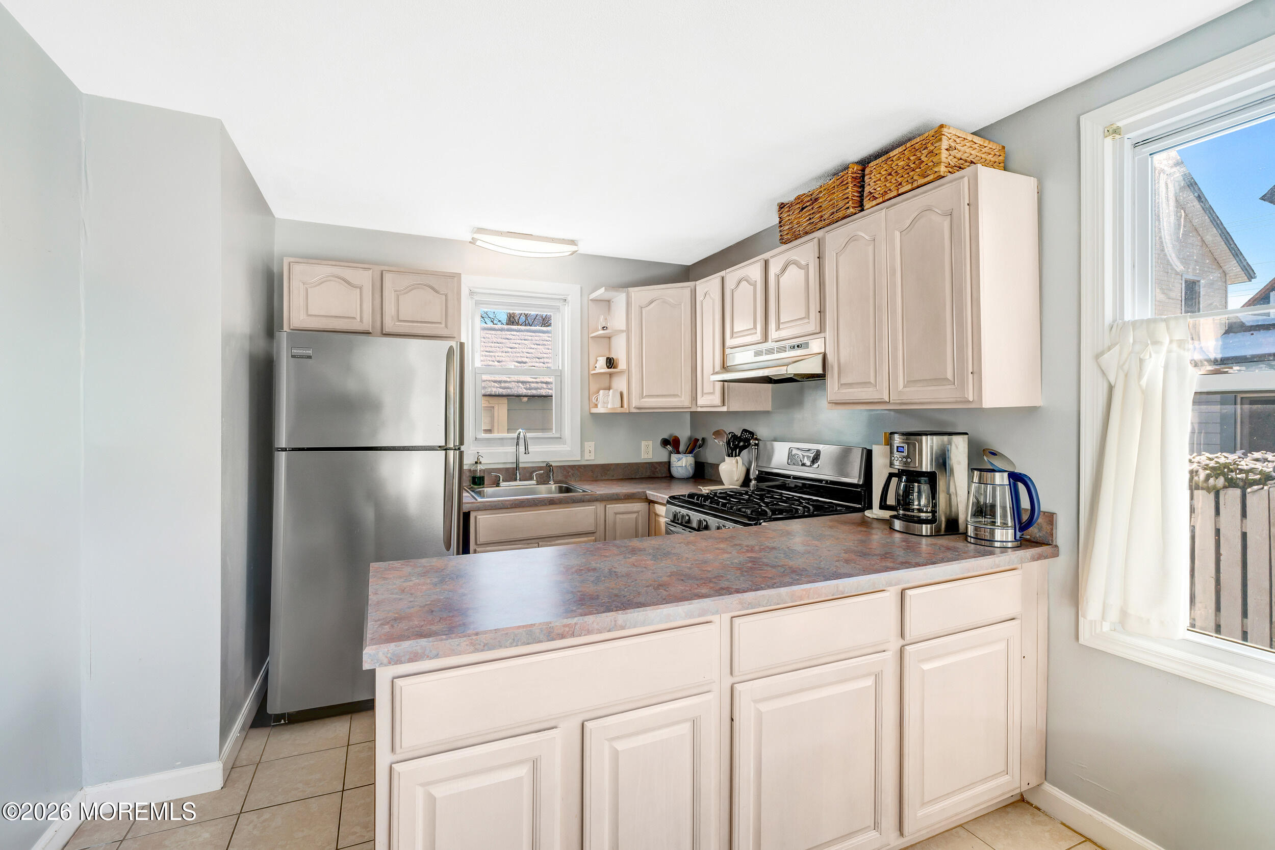 100 Mt Tabor Way Ocean Grove, NJ 07756 - Photo 19 of 34 a kitchen with stainless steel appliances granite countertop a refrigerator sink and cabinets
