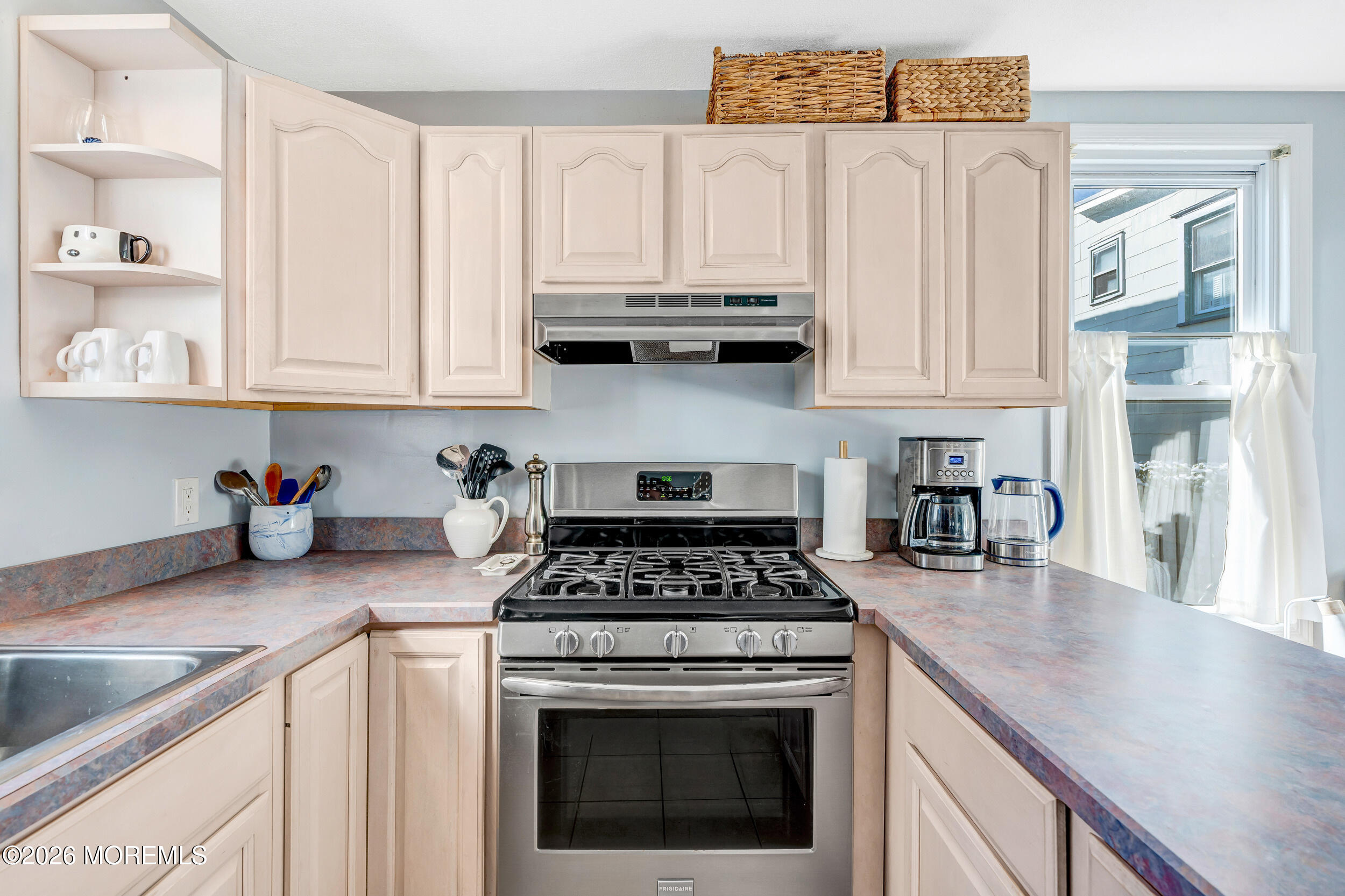 100 Mt Tabor Way Ocean Grove, NJ 07756 - Photo 21 of 34 a kitchen with granite countertop a stove a sink and dishwasher with white cabinets