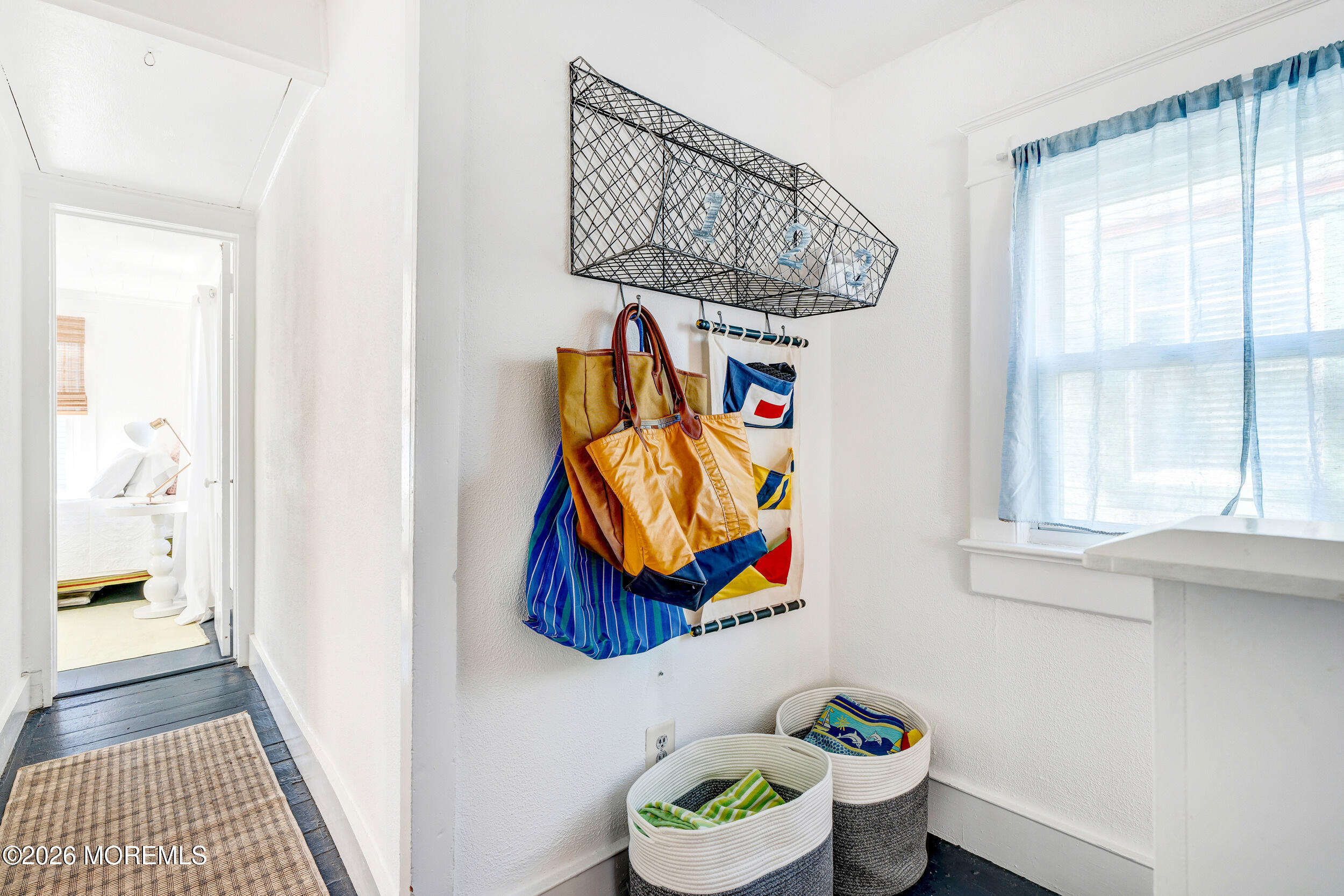 100 Mt Tabor Way Ocean Grove, NJ 07756 - Photo 25 of 34 a picture of a bathroom with a painting on the wall and a window
