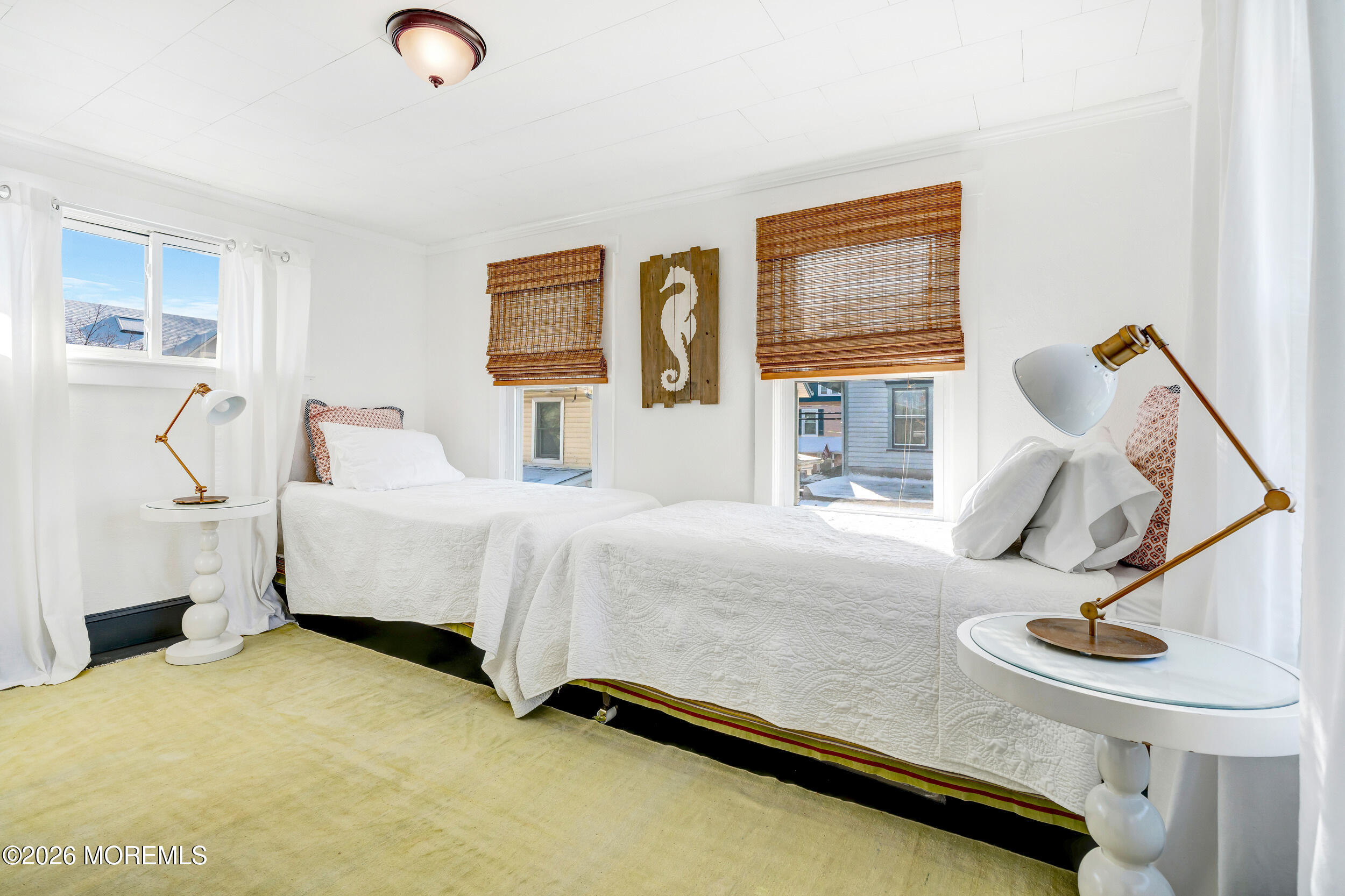 100 Mt Tabor Way Ocean Grove, NJ 07756 - Photo 27 of 34 a bedroom with a bed and glass windows