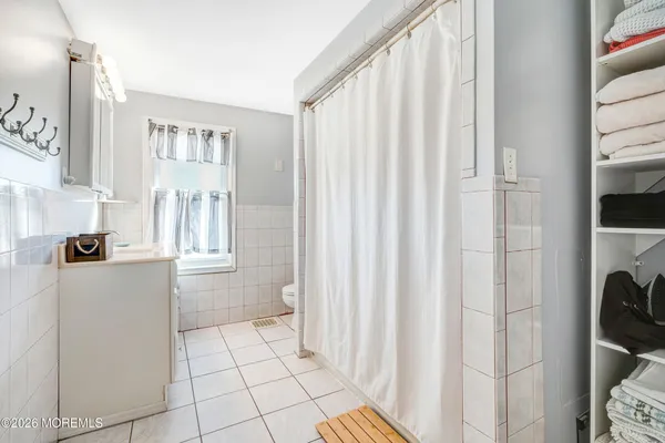 a bathroom with a bathtub and shower