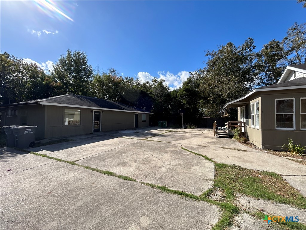 1511 East Constitution Street Victoria, TX 77901 - Photo 11 of 26 a view of a house with backyard and sitting area